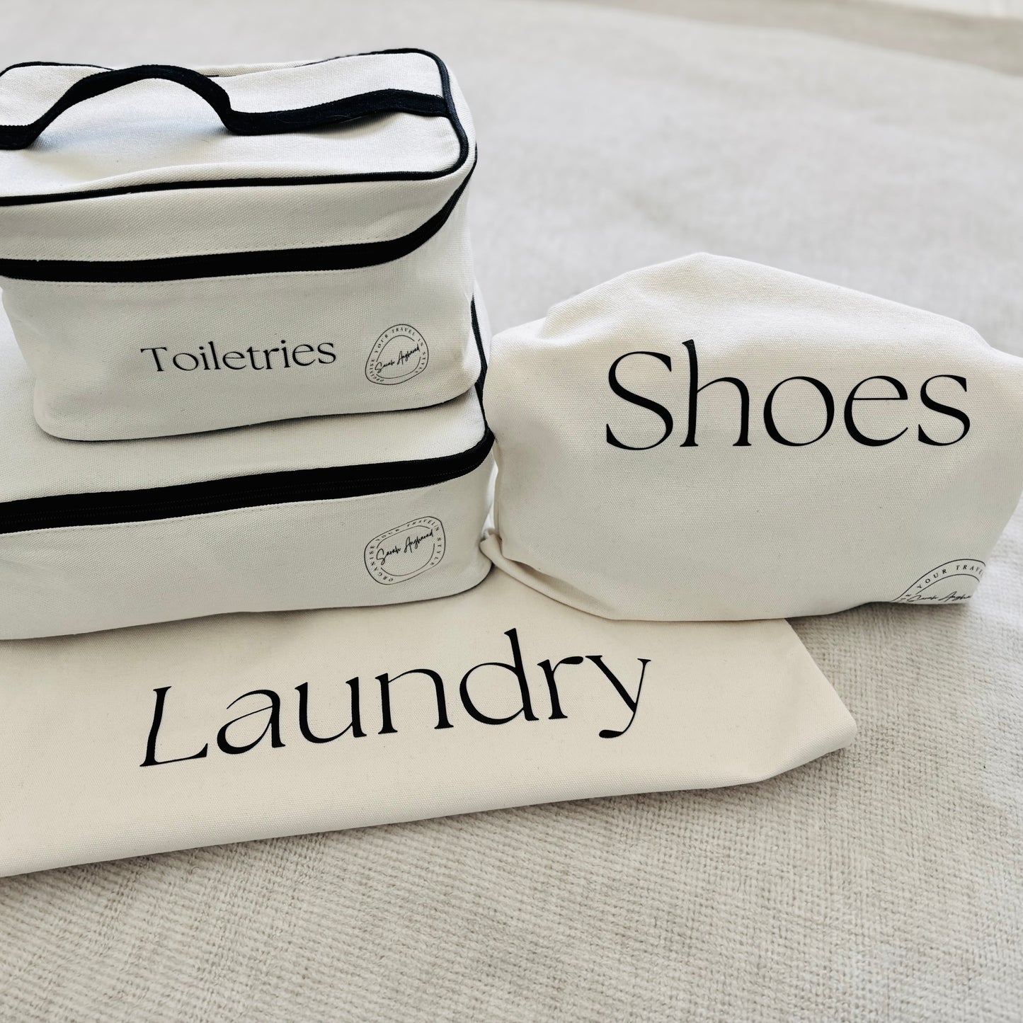 Travel Packing Set, one packing cube, one laundry bag, one shoe bag and a toiletries bag.
