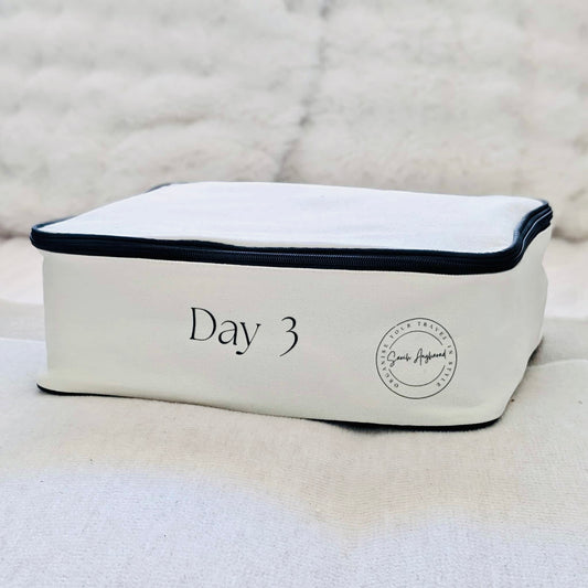 Cream Packing Cube with Day 3 and company logo
