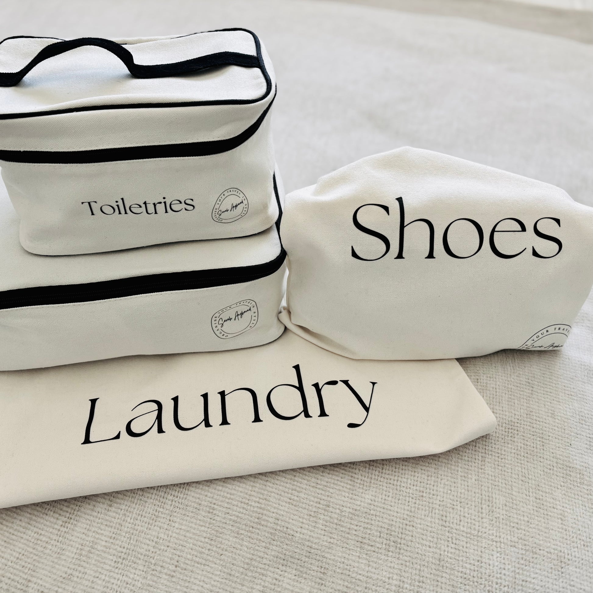 Travel Packing Set, one packing cube, one laundry bag, one shoe bag and a toiletries bag.